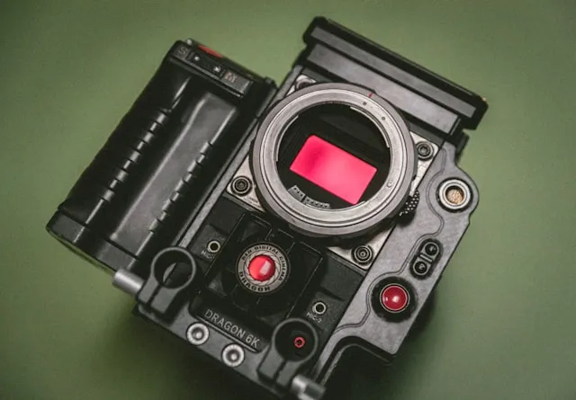 A digital camera with the sensor exposed.