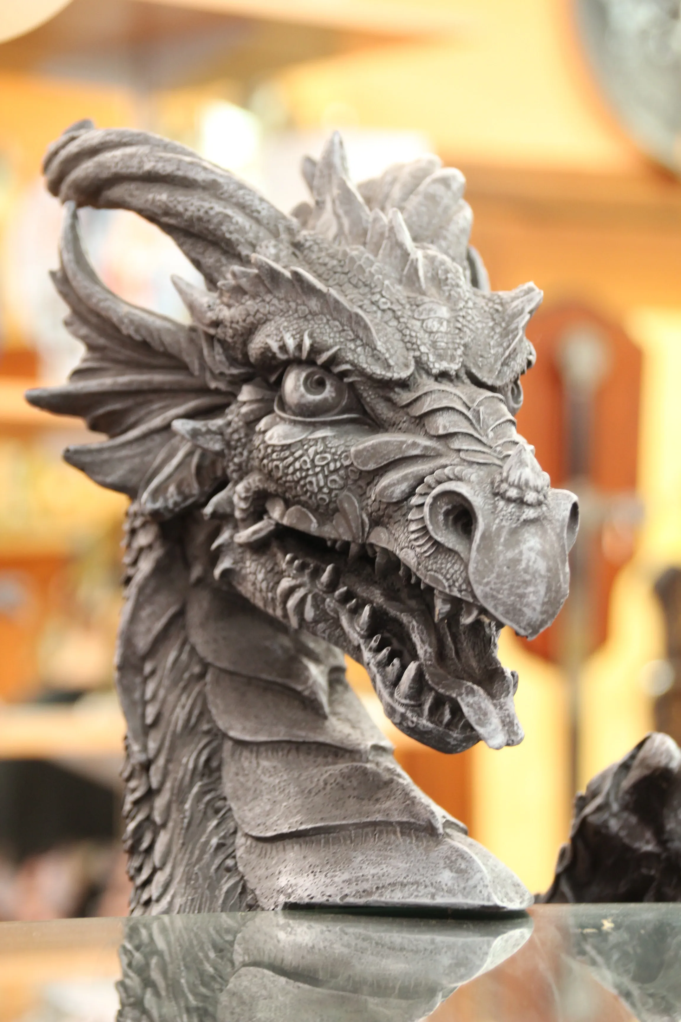 An italian statue of a dragon head